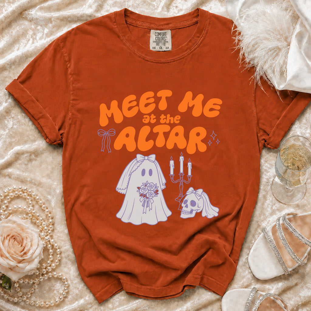 Orange t-shirt with "Meet me at the altar" text and ghost bride graphic.