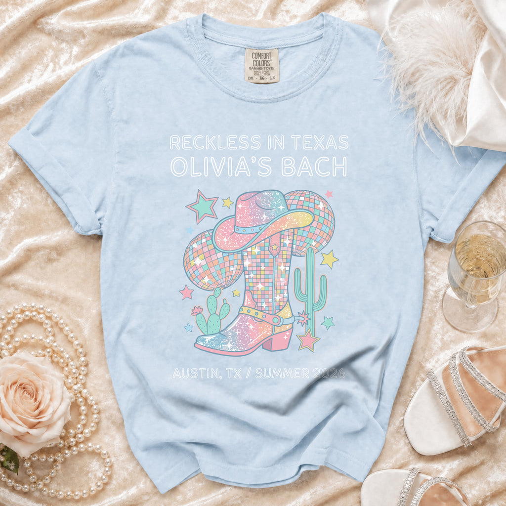 T-shirt with cowboy boot, disco ball, and text for Olivia's Bach.