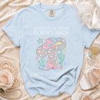 T-shirt with cowboy boot, disco ball, and text for Olivia's Bach.