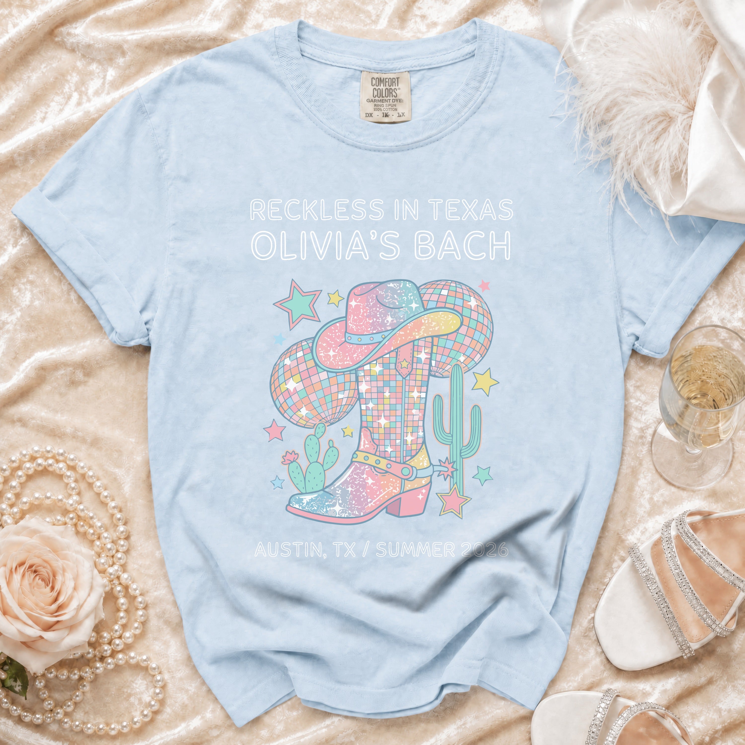 T-shirt with cowboy boot, disco ball, and text for Olivia's Bach.