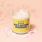 Candle with yellow label reading "BIG NEWS: SHE'S GETTING MARRIED!"