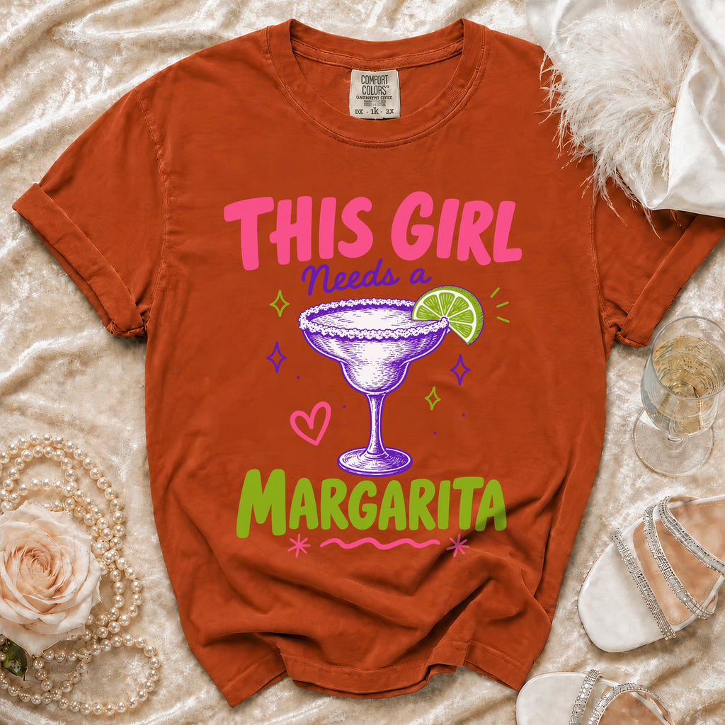 Orange t-shirt, "This Girl Needs a Margarita" text and graphic.