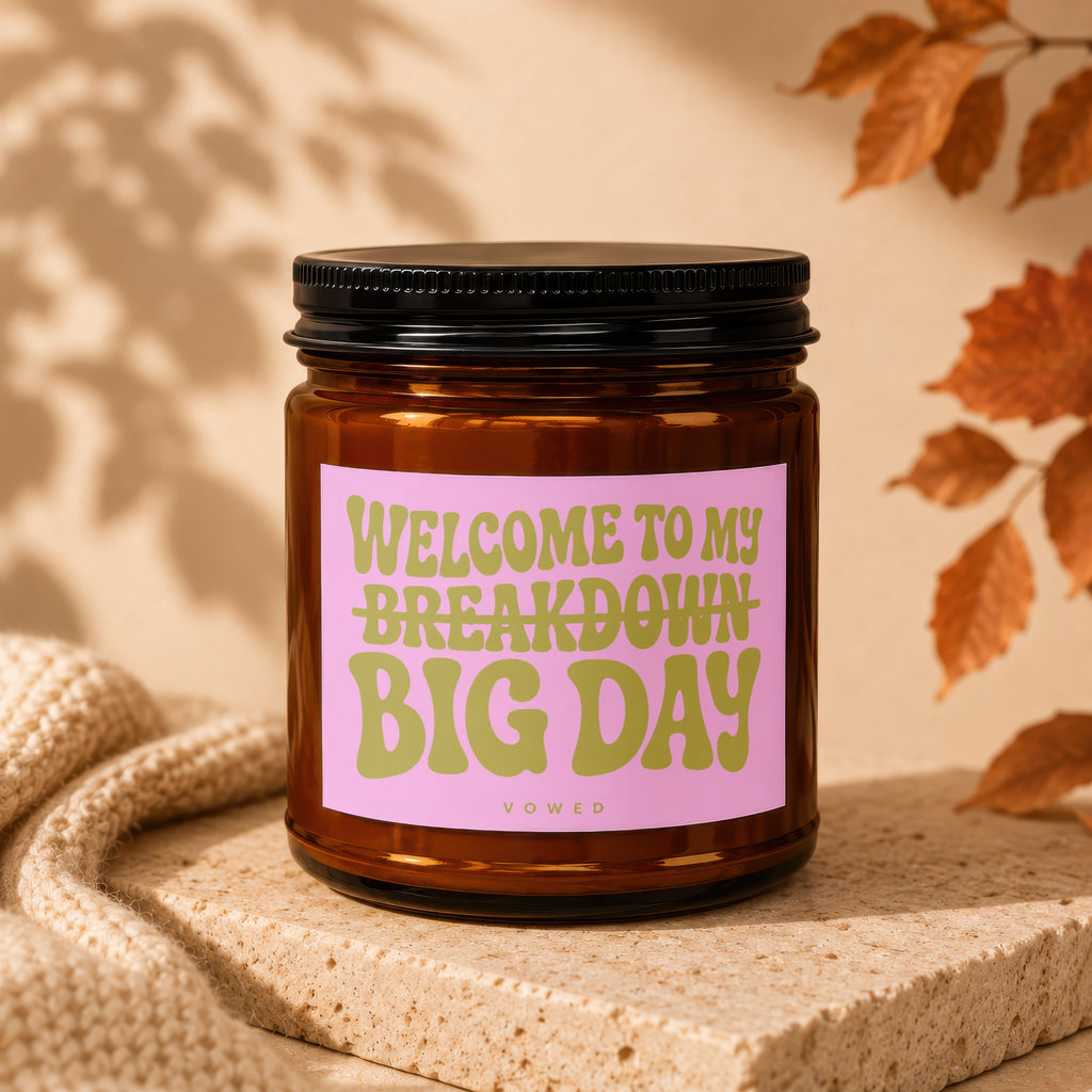 Amber jar candle with pink label reading "WELCOME TO MY BREAKDOWN BIG DAY".