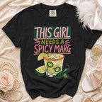 Black t-shirt with "This Girl Needs a Spicy Marg" text and margarita graphic.