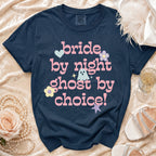 Navy t-shirt with "bride by night ghost by choice!" text and pastel graphics.