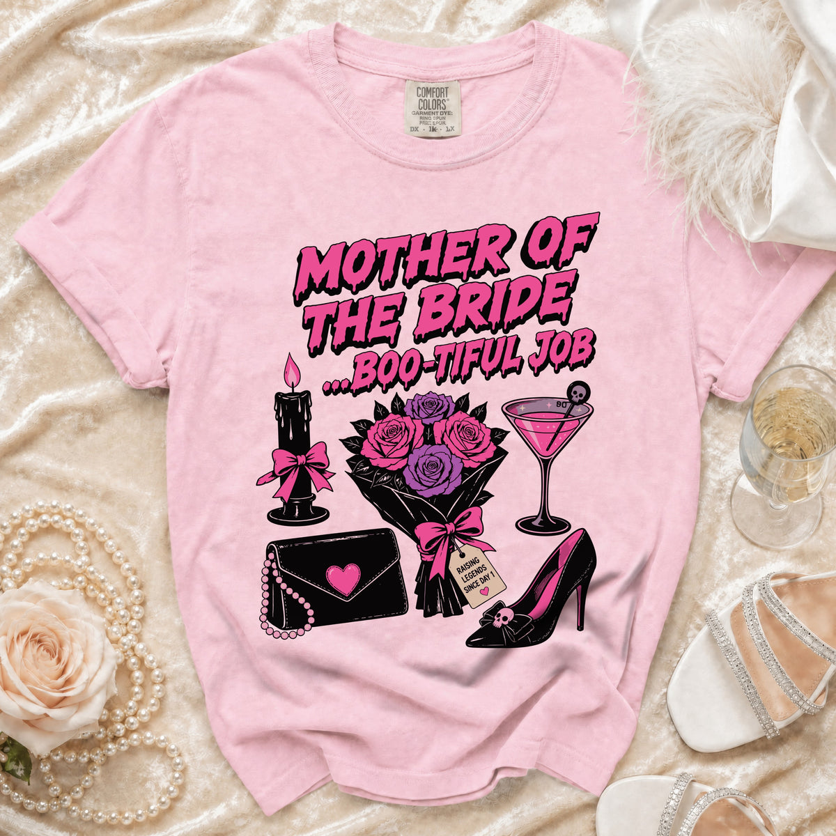 Pink t-shirt with "Mother of the Bride...Boo-tiful Job" graphic and accessories.