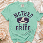 Mint green t-shirt with "Mother of the Bride" text and a witch hat graphic.