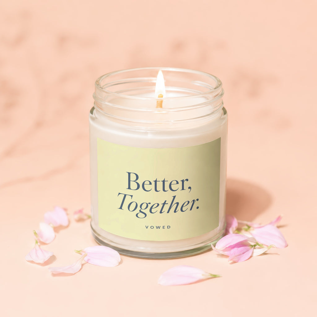 Glass jar candle with "Better, Together." text and pink petals on a peach background.