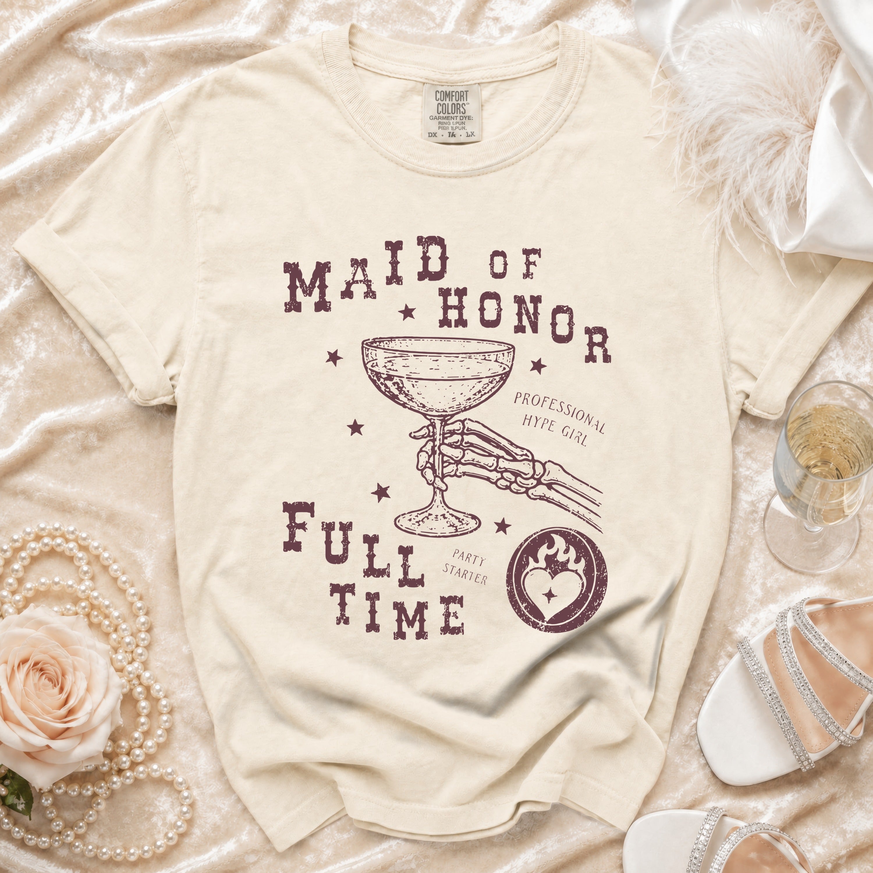 Cream t-shirt with "Maid of Honor Full Time" graphic and skeleton hand holding champagne.