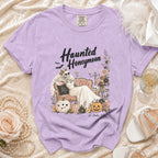 Lavender t-shirt with "Haunted Honeymoon" graphic of a skeleton bride and pumpkins.