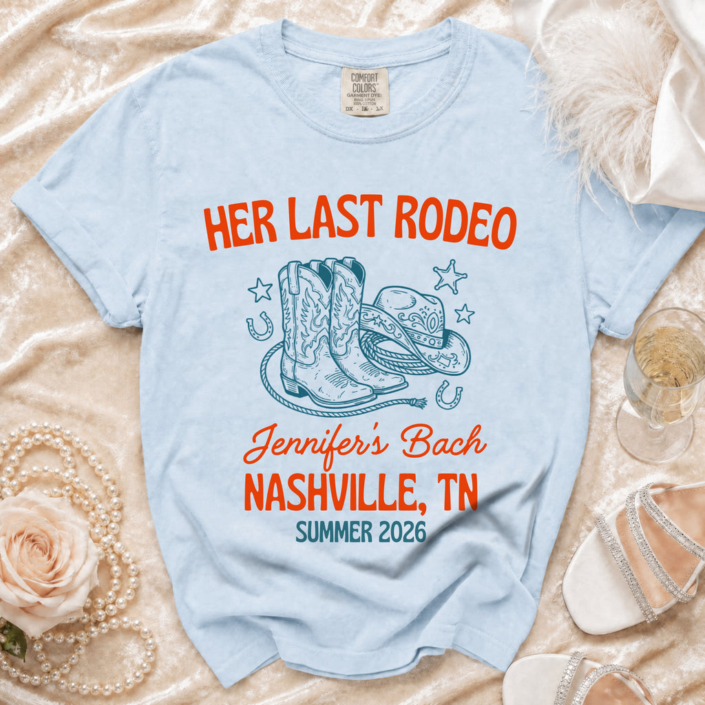 Light blue t-shirt with "Her Last Rodeo" and bachelorette details.