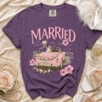 T-shirt with "MARRIED" graphic and a pink convertible with "JUST SAID YES" license plate.