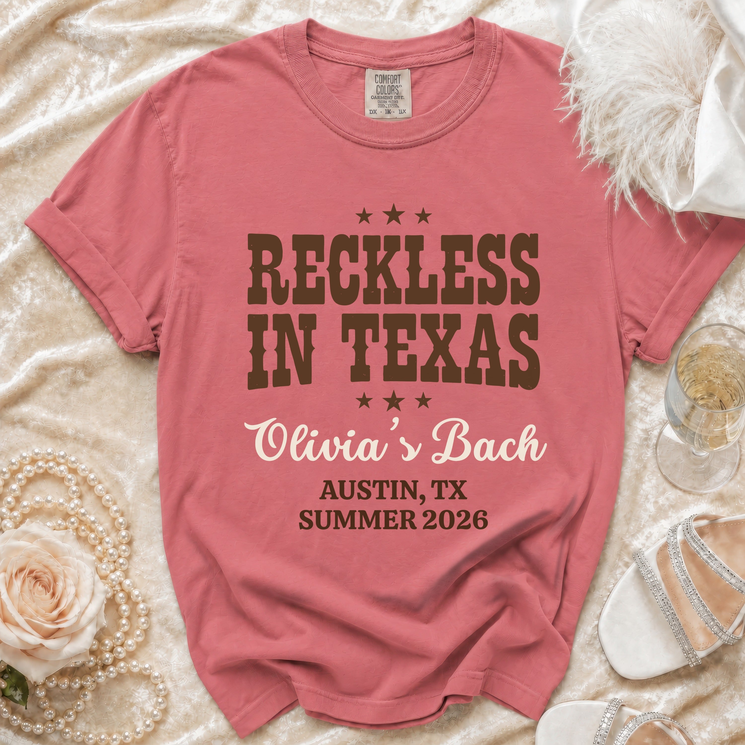 Rose t-shirt with "Reckless in Texas" and "Olivia's Bach" text.