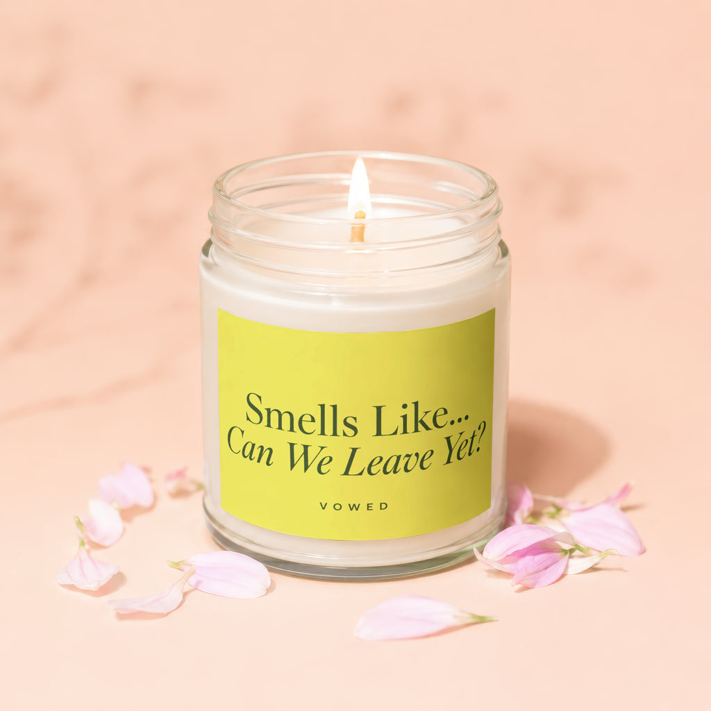 Lit candle with "Smells Like... Can We Leave Yet? VOWED" text on lime green label.