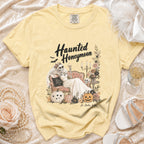 Yellow t-shirt with "Haunted Honeymoon" graphic of skeleton bride, pumpkins, and flowers.