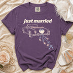 Purple t-shirt with "just married" text and vintage car graphic.