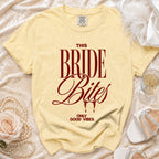 Yellow t-shirt with "THIS BRIDE Bites ONLY GOOD VIBES" text in maroon.