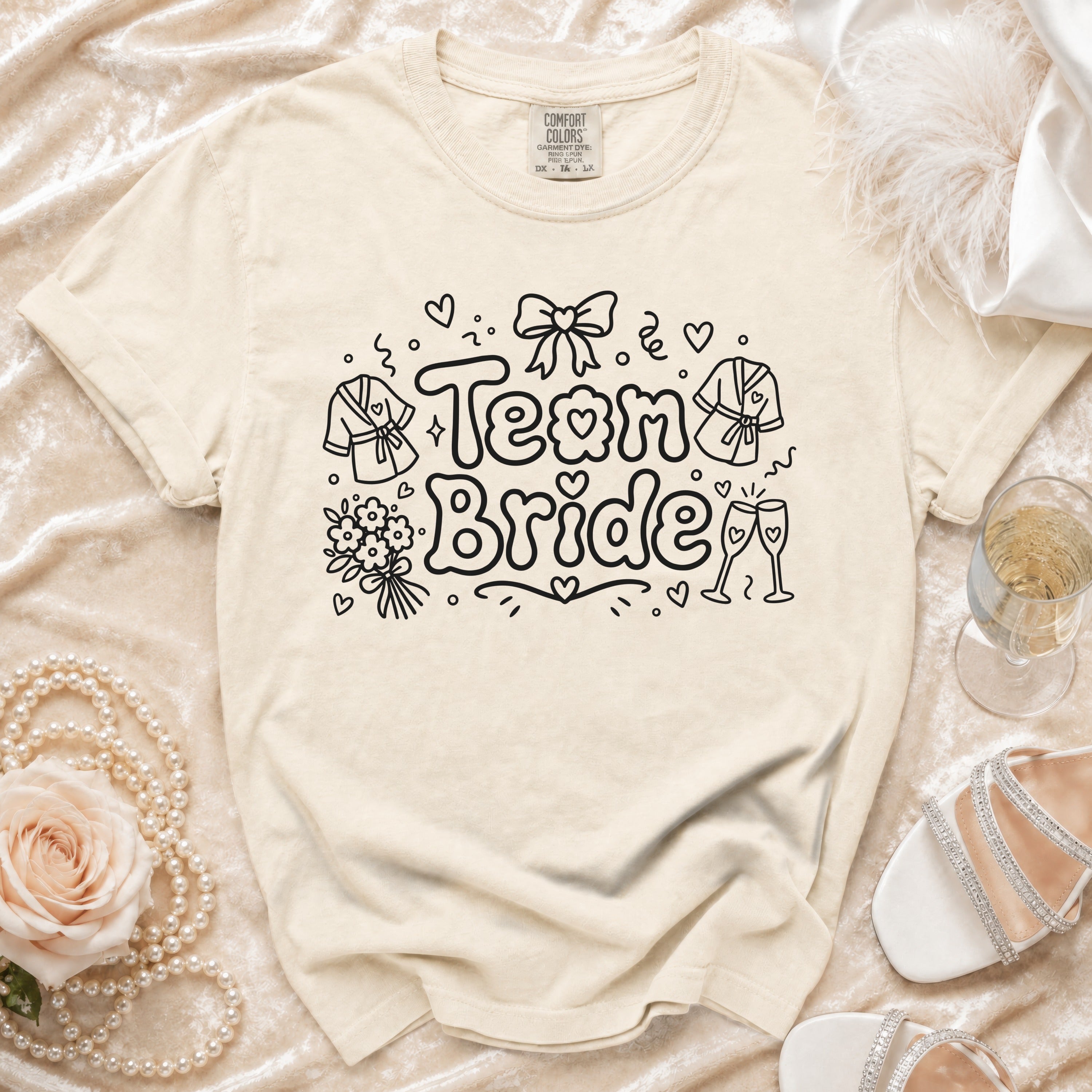 Cream t-shirt with "Team Bride" text and bridal icons.