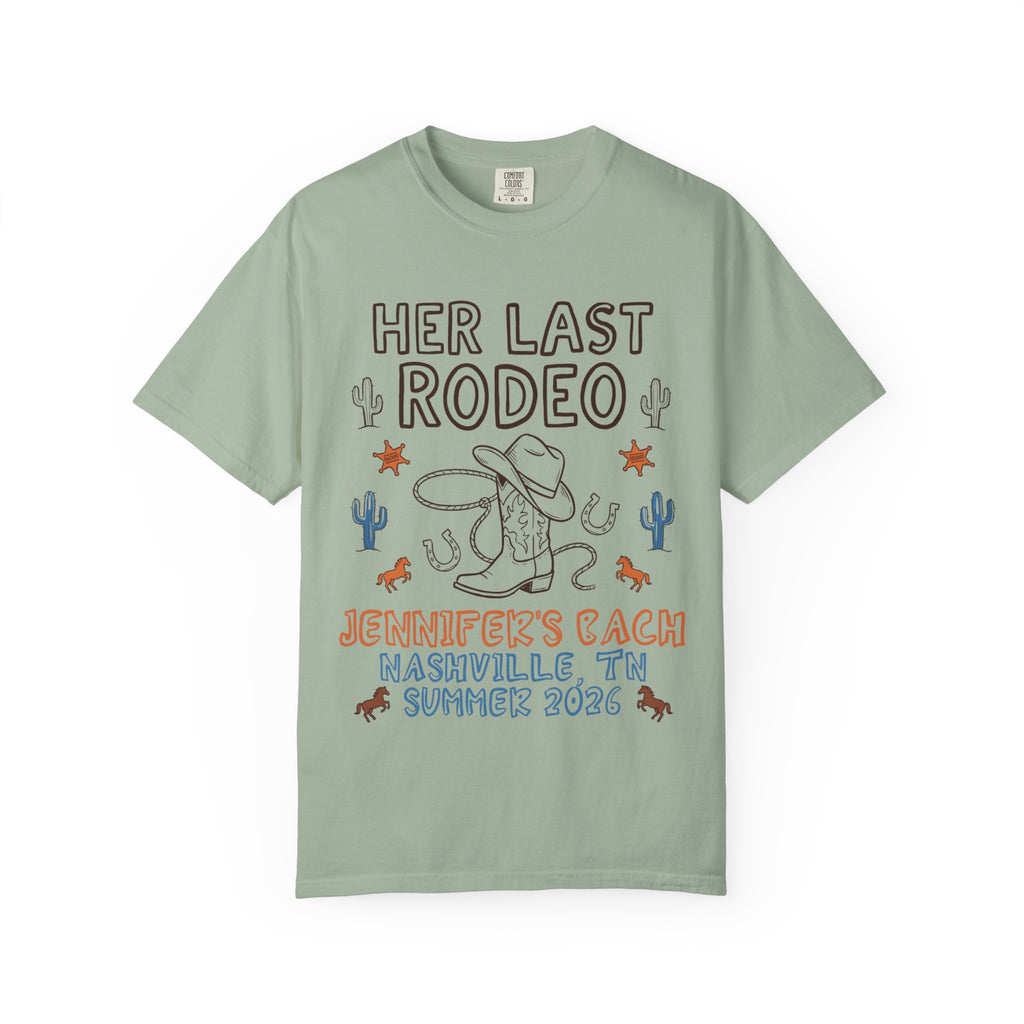 Her Last Rodeo graphic t-shirt with cowboy boots, hat, and rope.