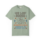 Her Last Rodeo graphic t-shirt with cowboy boots, hat, and rope.