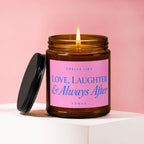 Amber jar candle with pink label reading "Smells Like Love, Laughter & Always After"