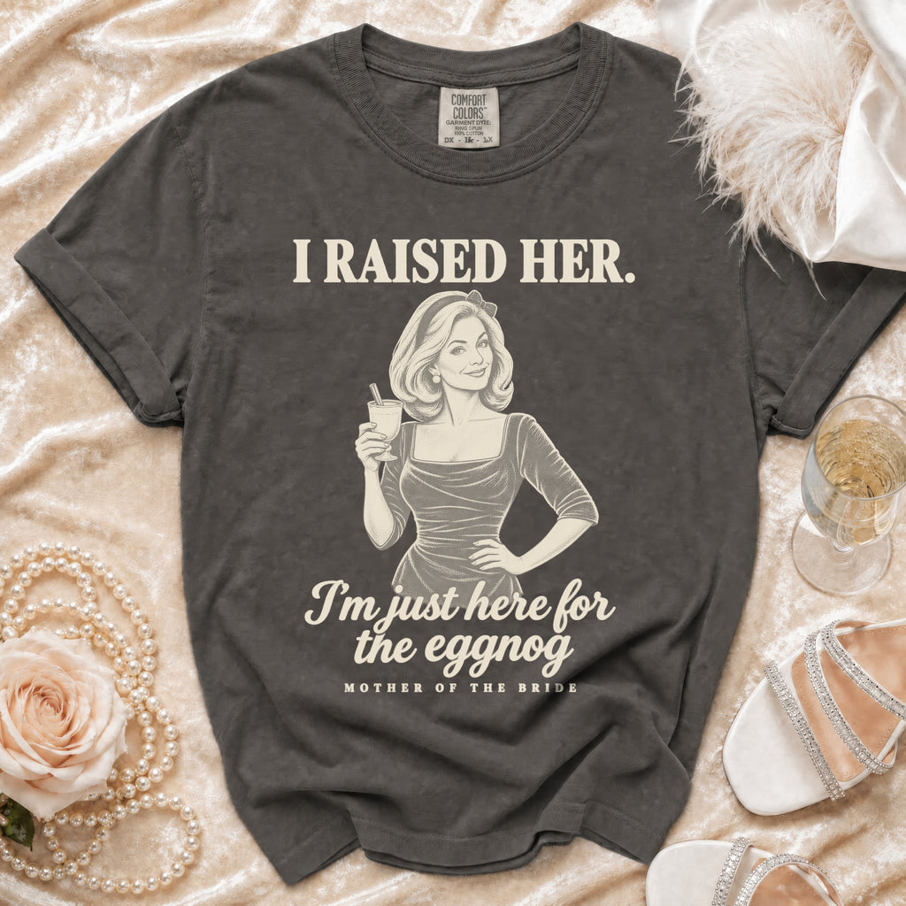 Charcoal gray t-shirt featuring the text I RAISED HER, an illustration of a woman drinking, and MOTHER OF THE BRIDE.