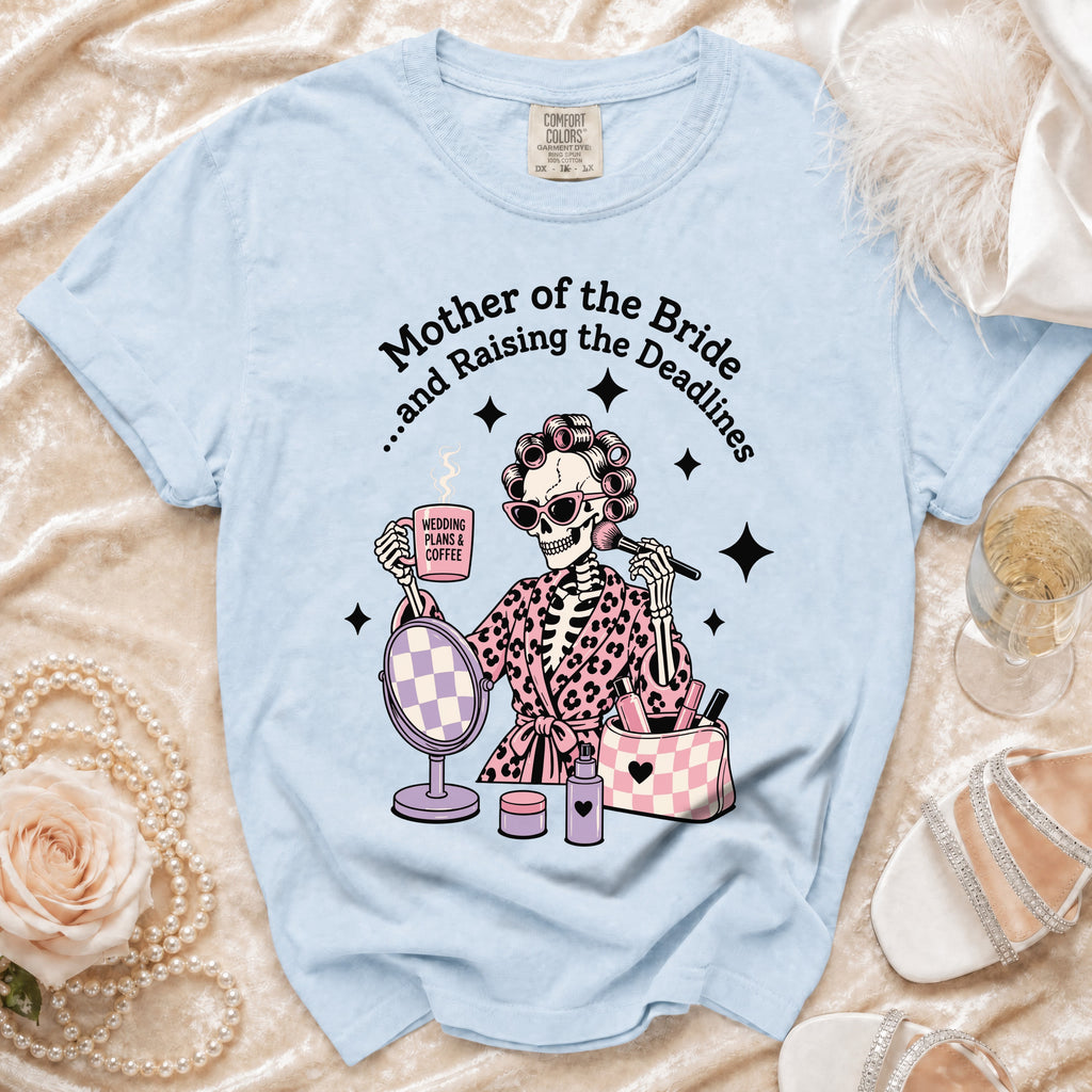 Light blue t-shirt with skeleton graphic of "Mother of the Bride" with coffee and makeup.