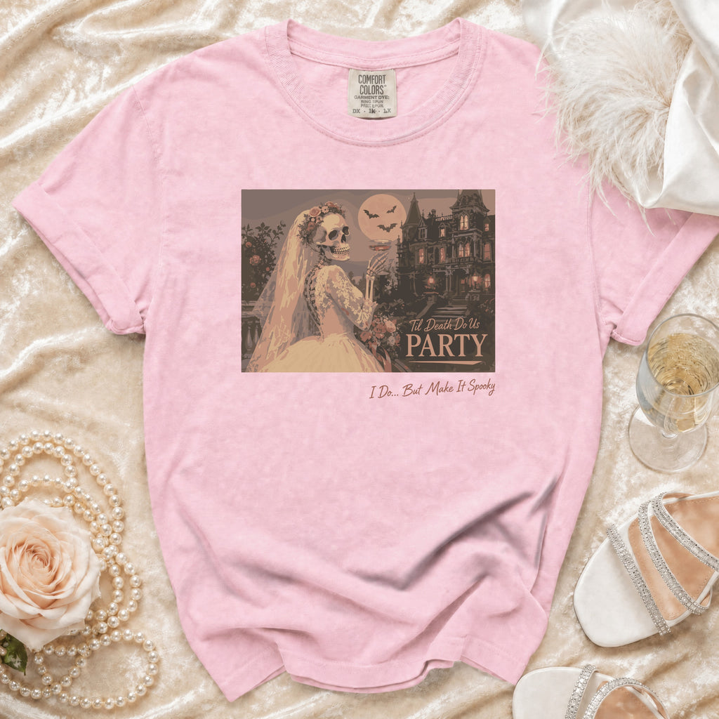 Pink t-shirt with skeleton bride, haunted house, and text: "Til Death Do Us PARTY" and "I Do... But Make It Spooky".