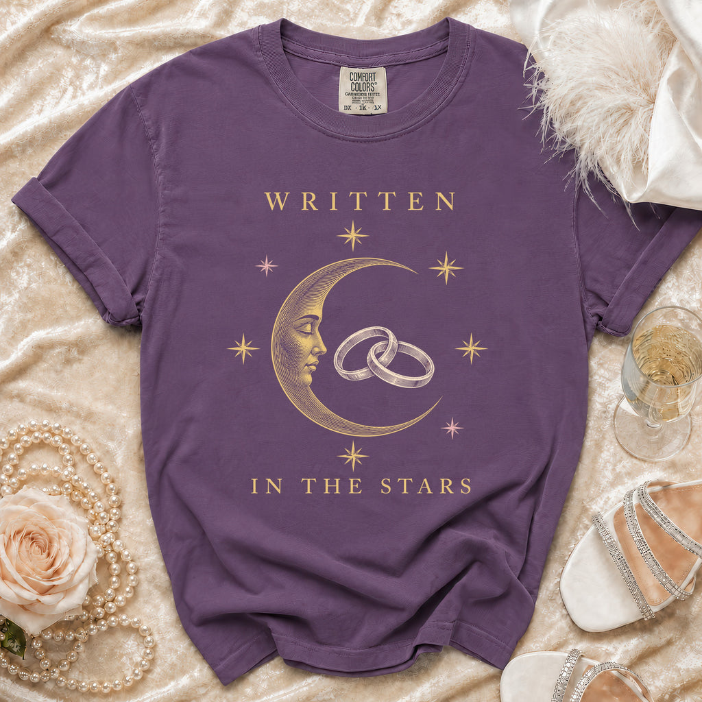 Purple t-shirt with moon, rings, and text "WRITTEN IN THE STARS".