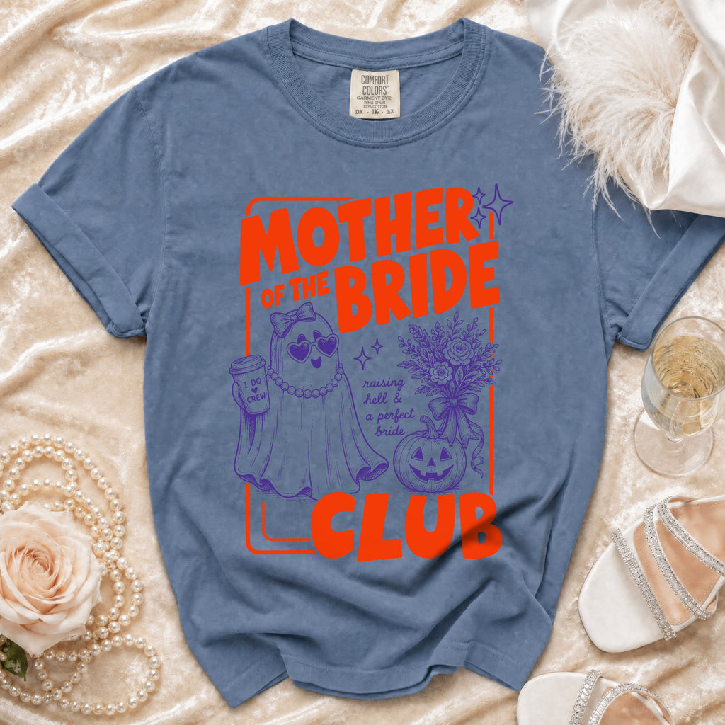 Blue t-shirt with "Mother of the Bride Club" text and ghost graphic.