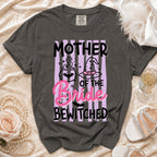 Dark grey t-shirt with "Mother of the Bride Bewitched" text and witchy graphics.