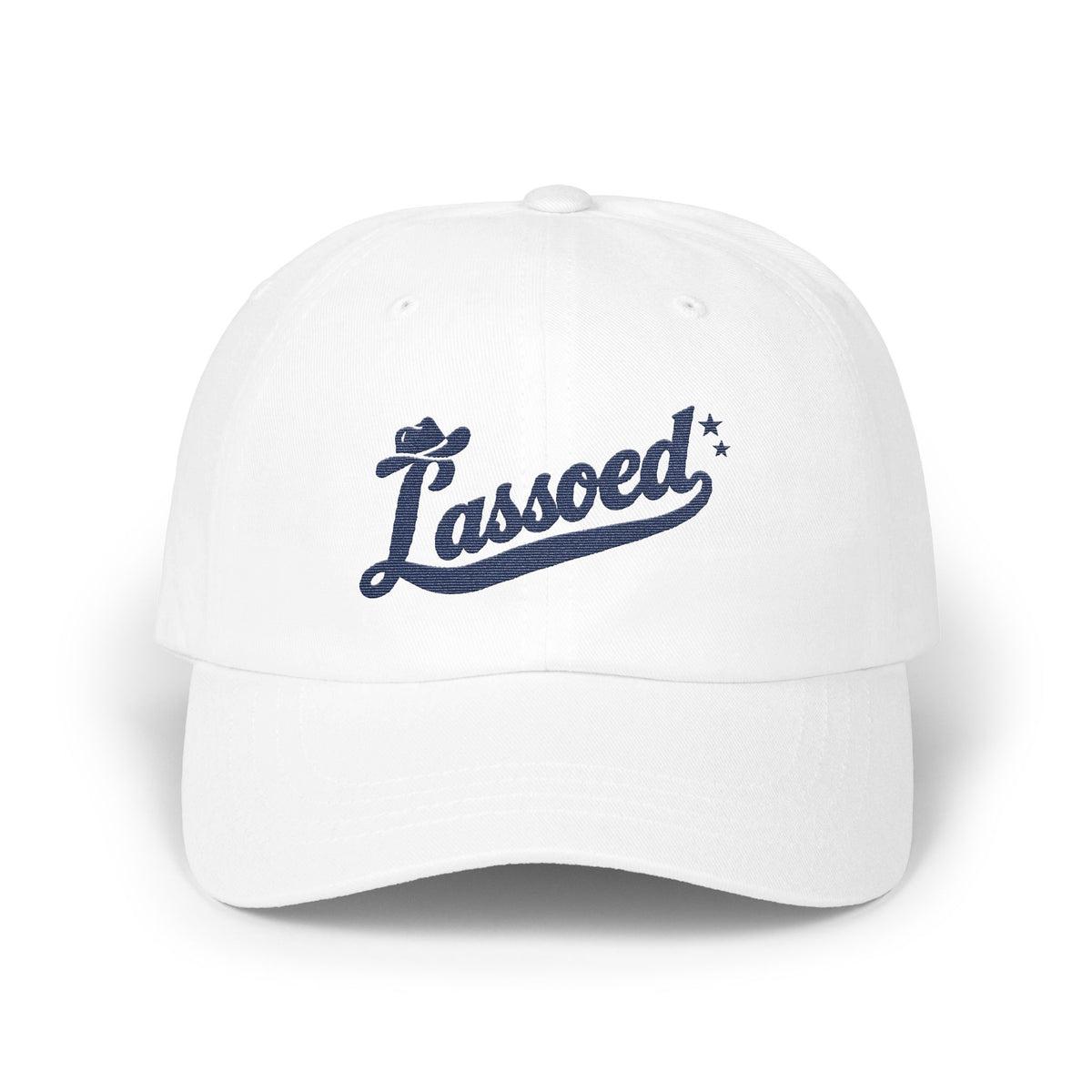 A white baseball cap featuring navy blue embroidered text that reads Lassoed with a cowboy hat and stars.