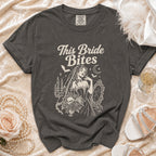 Dark grey t-shirt with "This Bride Bites" text and vampire bride illustration.