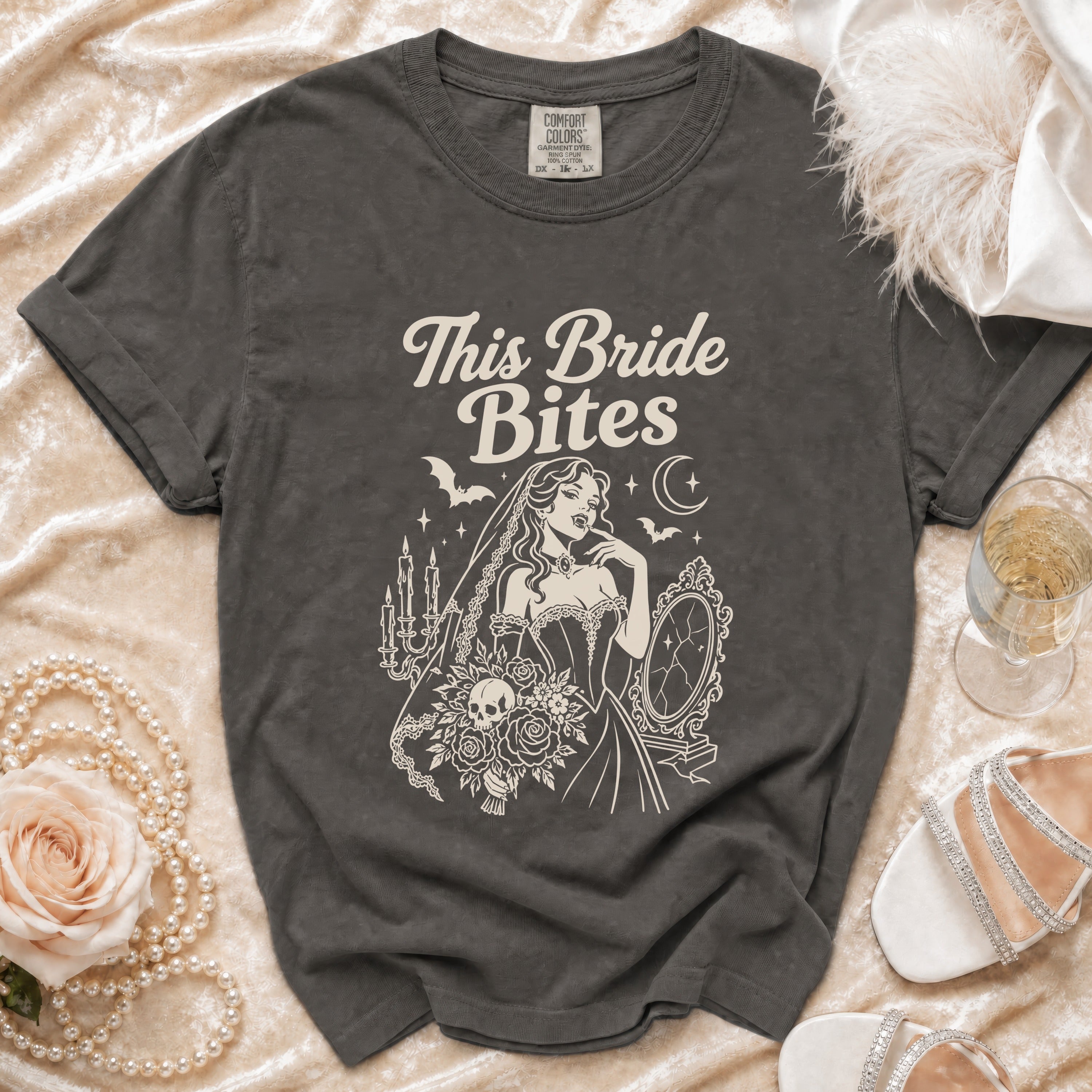 Dark grey t-shirt with "This Bride Bites" text and vampire bride illustration.