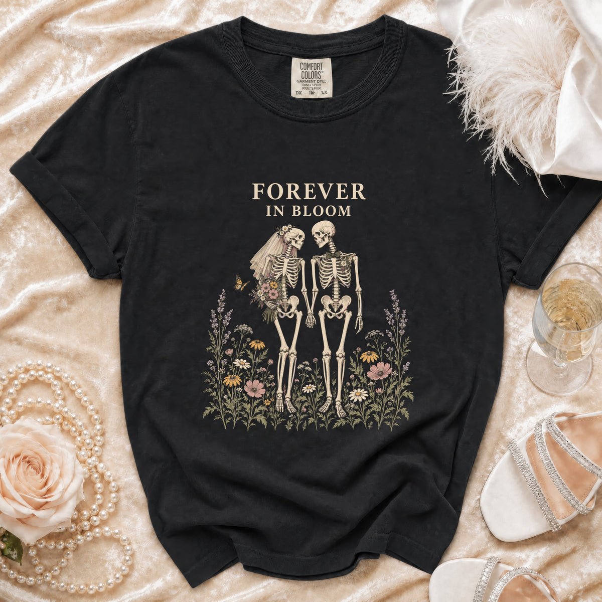Black t-shirt with "Forever In Bloom" text and skeleton couple graphic.