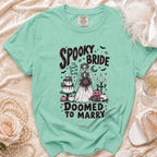Mint green shirt with "Spooky Bride" and "Doomed to Marry" skeleton bride graphic.
