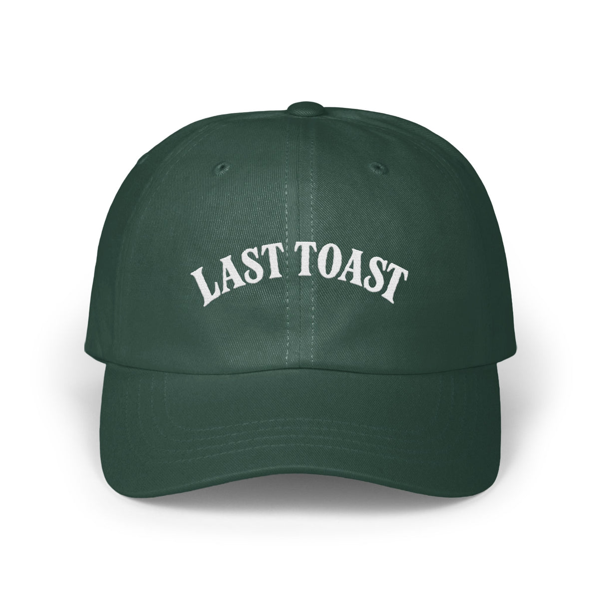 Green baseball cap with white embroidered text "LAST TOAST".