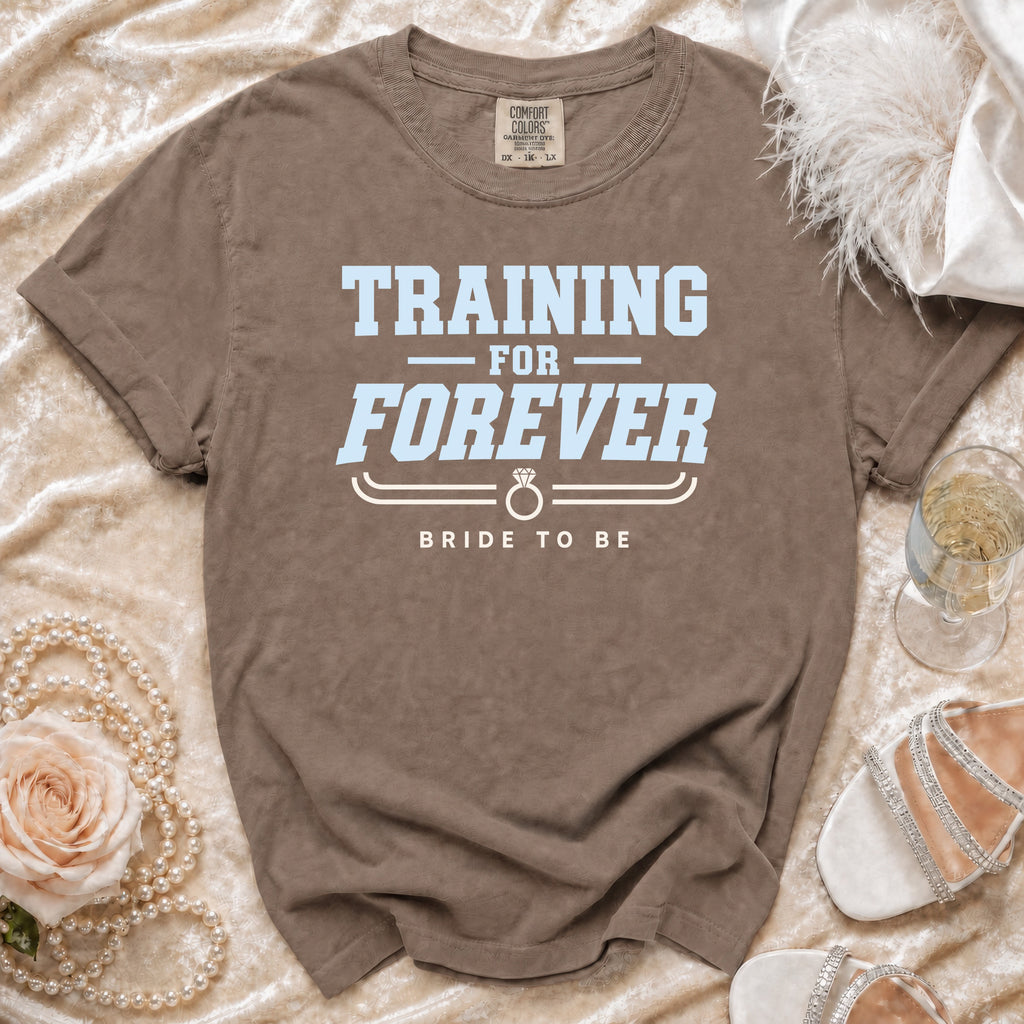 Brown t-shirt with "TRAINING FOR FOREVER BRIDE TO BE" text and ring graphic.