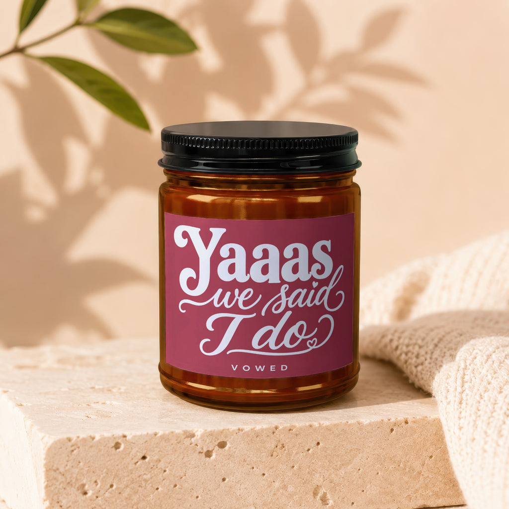 Candle with label reading "Yaaas we said I do" and "VOWED".