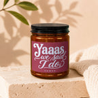 Candle with label reading "Yaaas we said I do" and "VOWED".