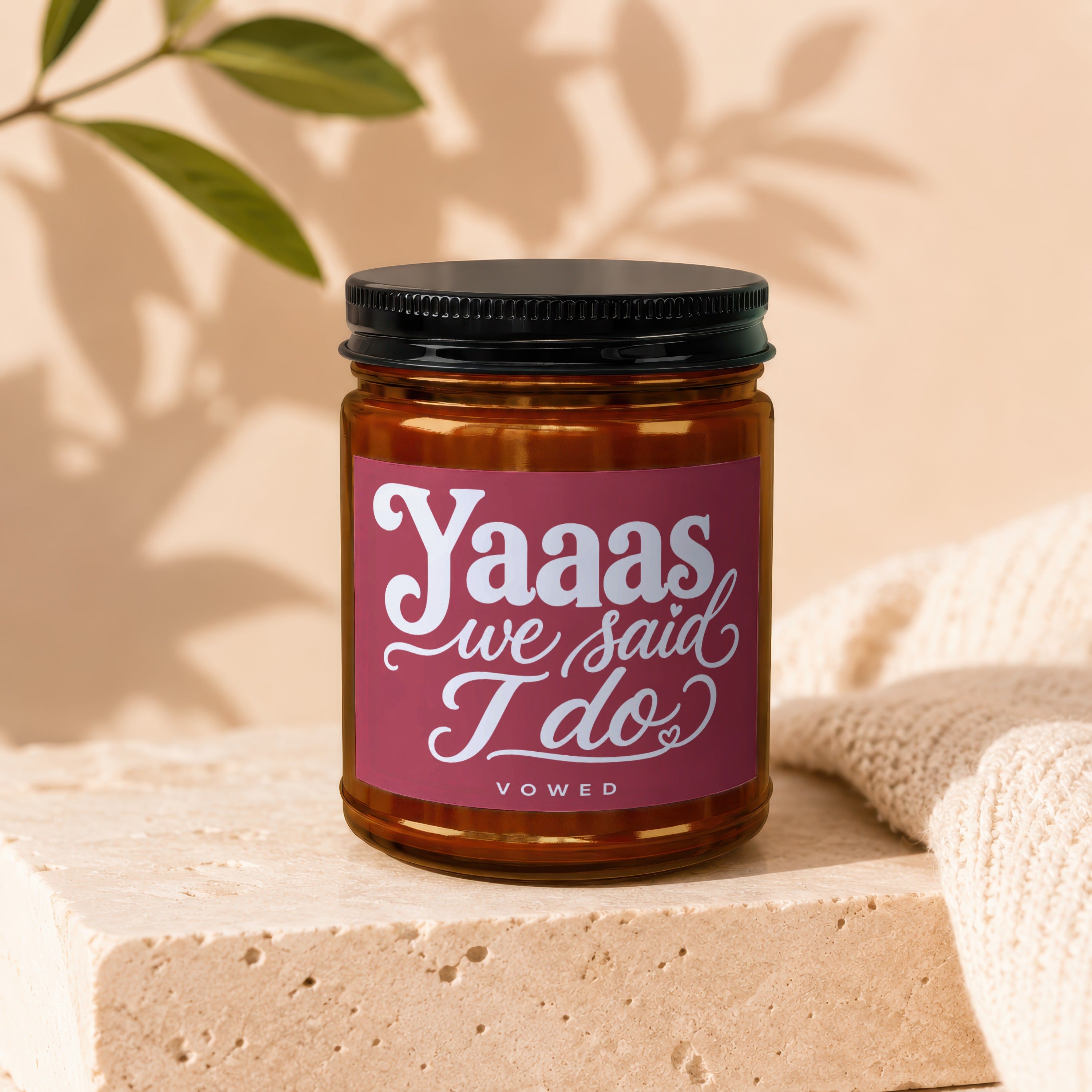 Candle with label reading "Yaaas we said I do" and "VOWED".