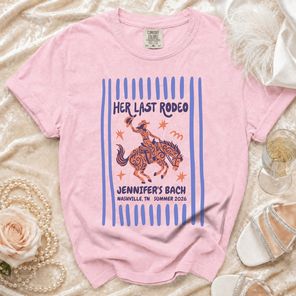 Pink t-shirt with "Her Last Rodeo" and cowboy graphic.