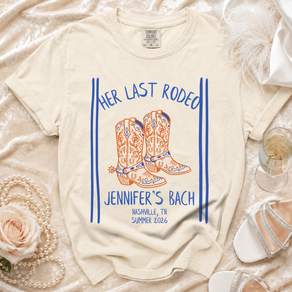 Cream t-shirt with "Her Last Rodeo" and "Jennifer's Bach Nashville, TN Summer 2026" text.
