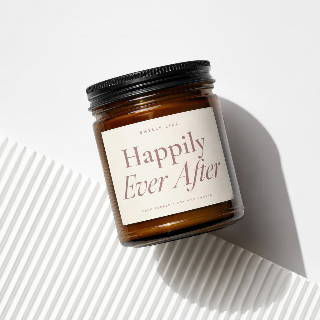 Amber jar candle with black lid labeled "Happily Ever After", from Smells Like.