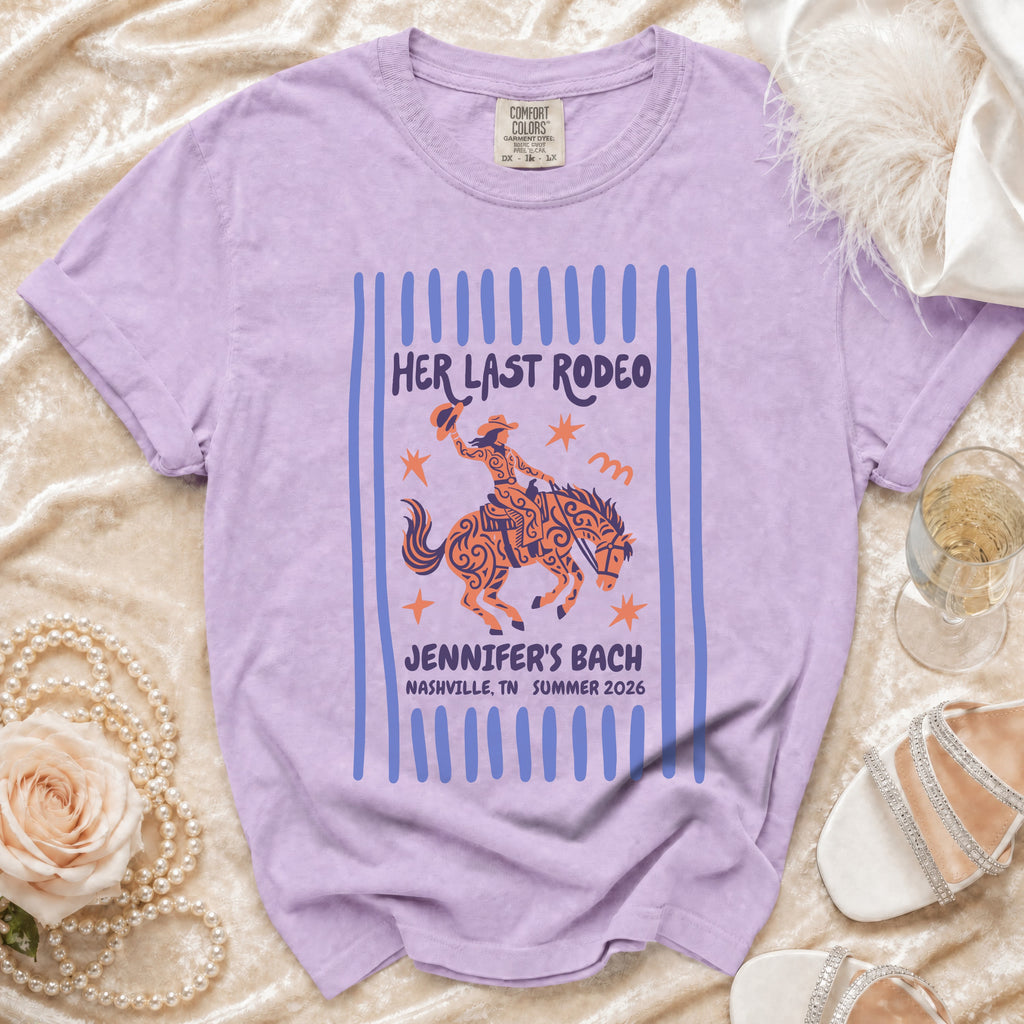 Purple t-shirt with "Her Last Rodeo Jennifer's Bach Nashville 2026" graphic.
