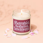 Jar candle with label reading "Betrothed, bothered, bewildered, VOWED".