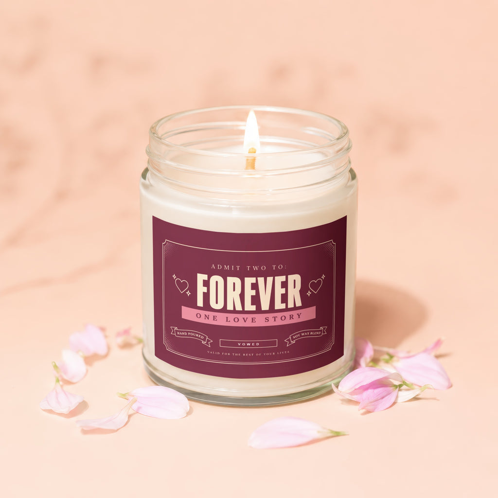 Candle with "Forever One Love Story" label and scattered pink petals.