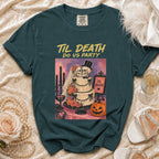 Dark teal t-shirt with "Til Death Do Us Party" graphic of skeleton couple, wedding cake, and pumpkin.