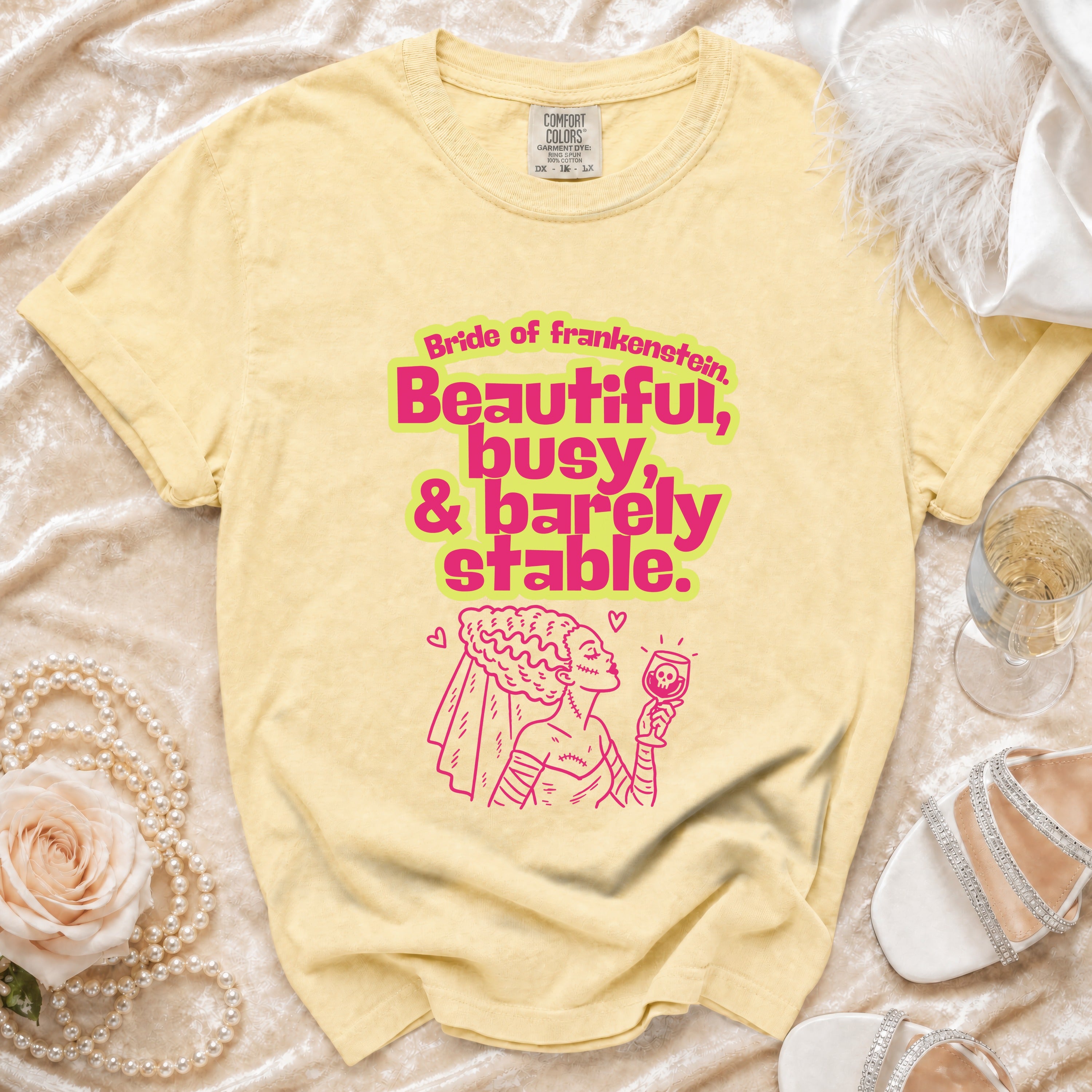 Yellow t-shirt with "Bride of Frankenstein, Beautiful, busy, & barely stable" text and graphic.