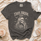 Dark gray t-shirt with "This Bride Bites" text and skeleton bride graphic.